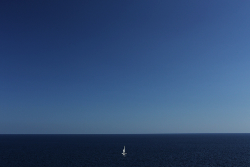 solitary boat in the mediterranean sea